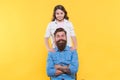 Because of child care matters. Happy child and father yellow background. Little child and bearded man. Family relations Royalty Free Stock Photo