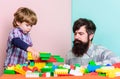 Child care and upbringing. Father son game. Father son create constructions. Father and boy play together. Dad and kid Royalty Free Stock Photo