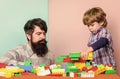 Child care and upbringing. Father son game. Father son create constructions. Father and boy play together. Dad and kid Royalty Free Stock Photo