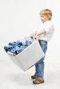 Child carrying box with jeans. Kids clothing