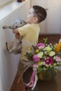 Child, cat and bouquet in pumpkin Royalty Free Stock Photo