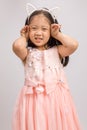 Child with Cat Ear Headband in Pink Dress, Isolated on White Royalty Free Stock Photo