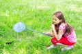 Child catches a butterfly