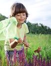 Child catches a butterfly