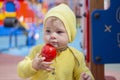 A child of a Caucasian Caucasian plays sand molds in a sandbox. Child baby girl boy one year old playing on the playground in the Royalty Free Stock Photo