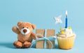 Child celebration theme with a cupcake and teddy bear