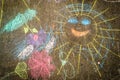Child Chalk Drawing on Asphalt