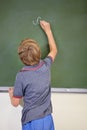 Child, chalkboard and school writing with education, cursive and answer for learning. Back, knowledge and kid Royalty Free Stock Photo