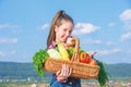 Child cheerful celebrate harvest holiday vegetables basket. Harvest festival concept. Childhood in countryside. Kid