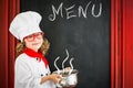 Child chef cook. Restaurant business concept Royalty Free Stock Photo