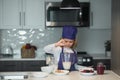 Child chef cooking meal. Kids are preparing the dough, bake cookies in the kitchen. Royalty Free Stock Photo