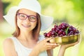 Child with cherries. Little girl with fresh cherries. Portrait of a smiling young girl with bowl full of fresh cherries Royalty Free Stock Photo