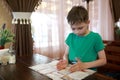 Child chooses food using menu in restaurant