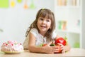 Child choosing healthy vegetables instead of