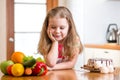 Child choosing between healthy vegetables and Royalty Free Stock Photo