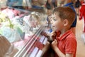 Child choosing ice cream in cafe