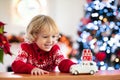 Child with Christmas present. Kid with Xmas gift Royalty Free Stock Photo