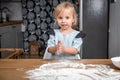 Child Clapping Floury Hands While Baking in Home Kitchen Royalty Free Stock Photo