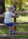 Child climbing the fence Royalty Free Stock Photo