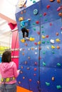 Child climbing an indoor wall