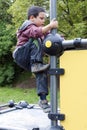 Child Climbing At Playground