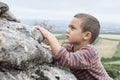 Child climbing on rock Royalty Free Stock Photo