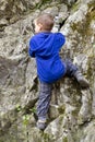 Child climbing a rock Royalty Free Stock Photo