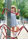 Child climbing at ropes on playground