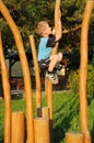 Child Climbing Wooden Column