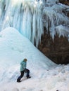 A child climbs on icy hill
