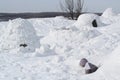 The child climbs out of the snow cave - dwelling Inuit, Igloo Royalty Free Stock Photo