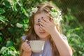 Child clings to his forehead and frowns from the intoxicating smell Royalty Free Stock Photo