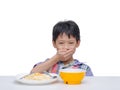 Child close his mouth by hand between having lunch