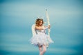 A child in the clothes of an angel on sky background - Valentine concept. The God of Love. Real fairy from magical Royalty Free Stock Photo