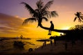 Child on Coconut tree - Sunset beach