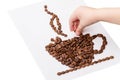 Child collects a cup made of coffee beans