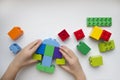 The hands of the child collector constructor. Educational toys for young children.