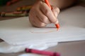 Child Coloring on Blank White Paper with Color Crayons Royalty Free Stock Photo