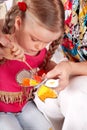 Child with colour pencil in play room. Royalty Free Stock Photo