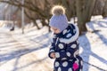 child concentrates on crushing bread for birds