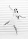 Child concept. Happy little child dancing. Child girl smile in fashion dress. Child and childhood. sense of freedom Royalty Free Stock Photo