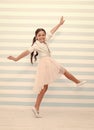 Child concept. Happy little child dancing. Child girl smile in fashion dress. Child and childhood. sense of freedom