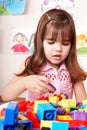 Child with construction set in play room. Royalty Free Stock Photo