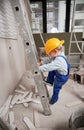 Little boy climbing ladder in apartment under renovation. Royalty Free Stock Photo