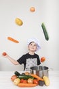 Child cooking with vegetables