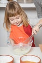 Child cooking whipping yogurt