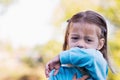 Child coughing or sneezing into arm Royalty Free Stock Photo