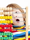 Child Counting on Colorful Wooden Abacus