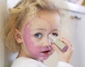 Child covered in lipstick Royalty Free Stock Photo