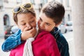 Child covers mouth of his sister, portrait